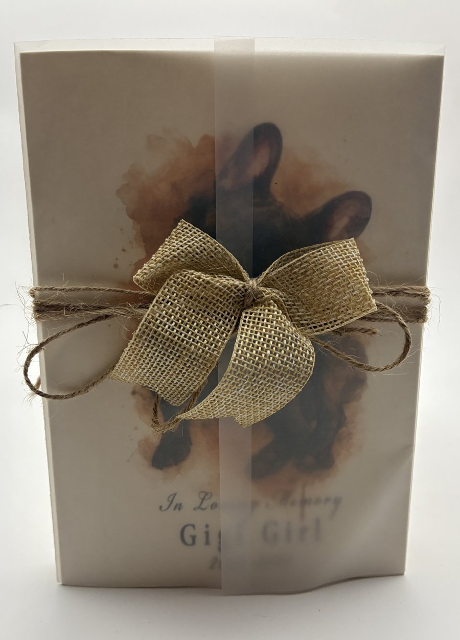 Gigi Girl memorial card wrapped in vellum with a burlap bow